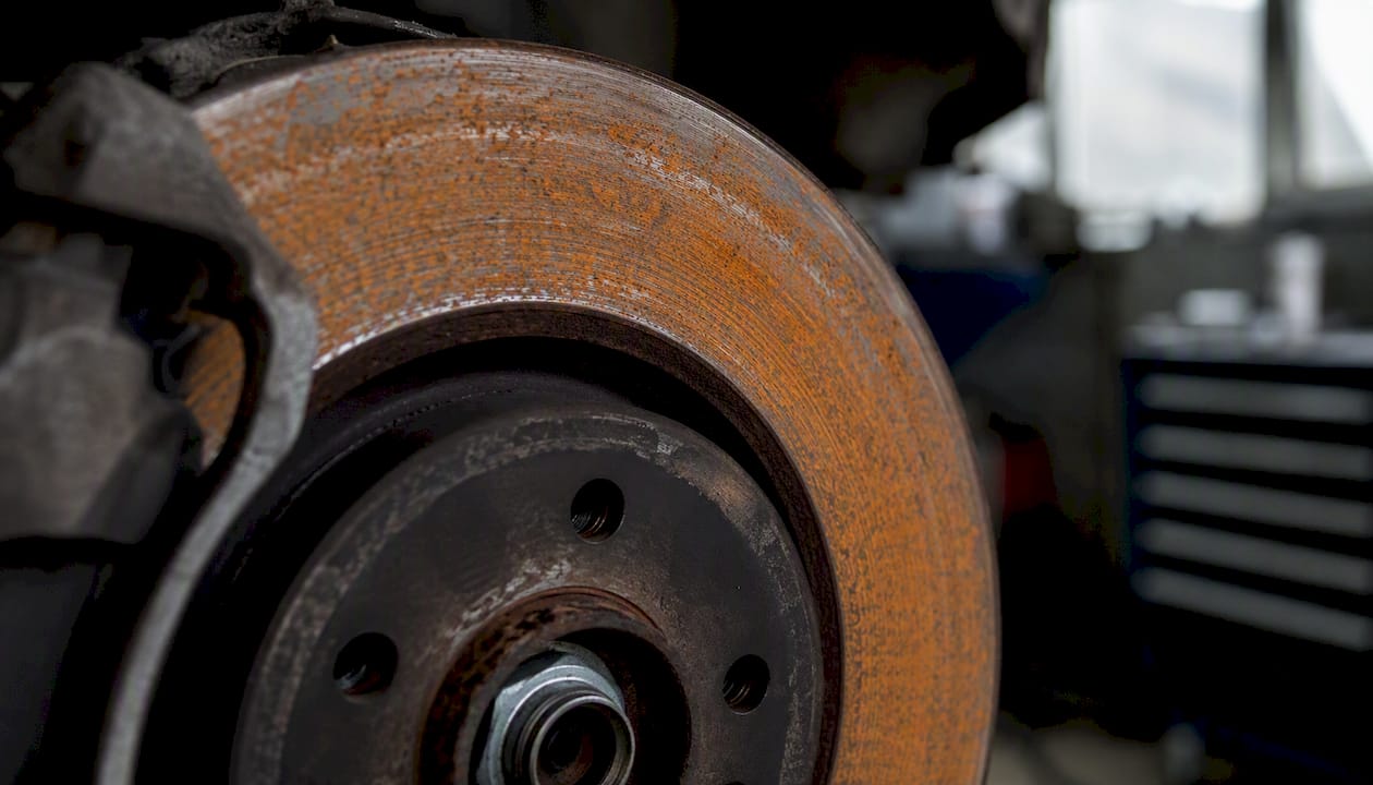 Close-up of brake rotor with orange flash rust