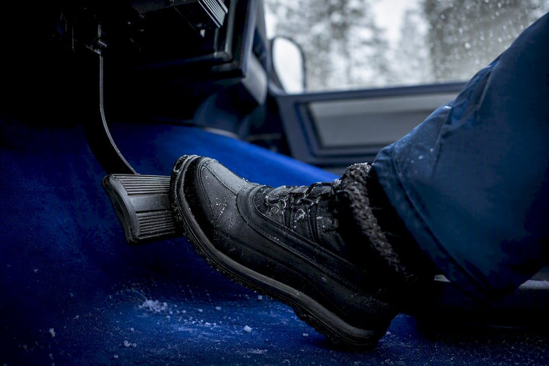 Brake pedal being pressed in cold weather car interior