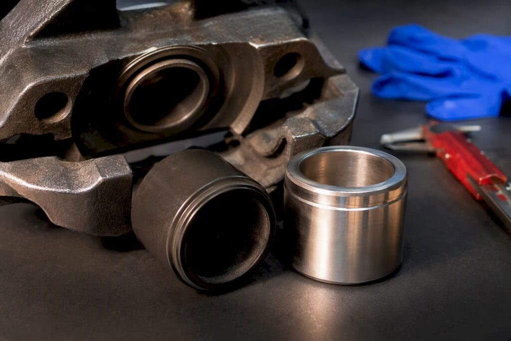 Phenolic and steel brake pistons on inspection bench