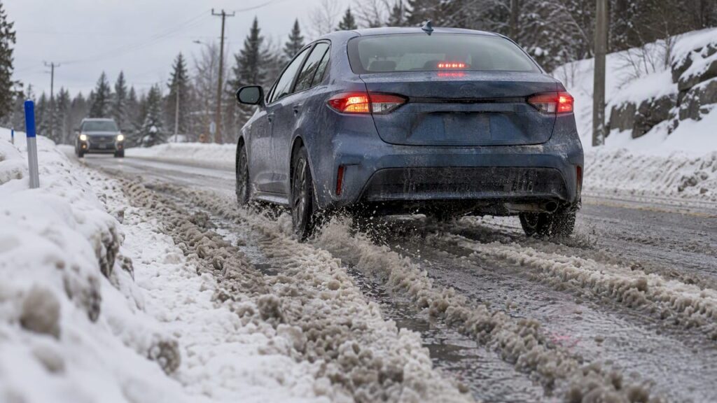 Car braking on a slushy Canadian road
