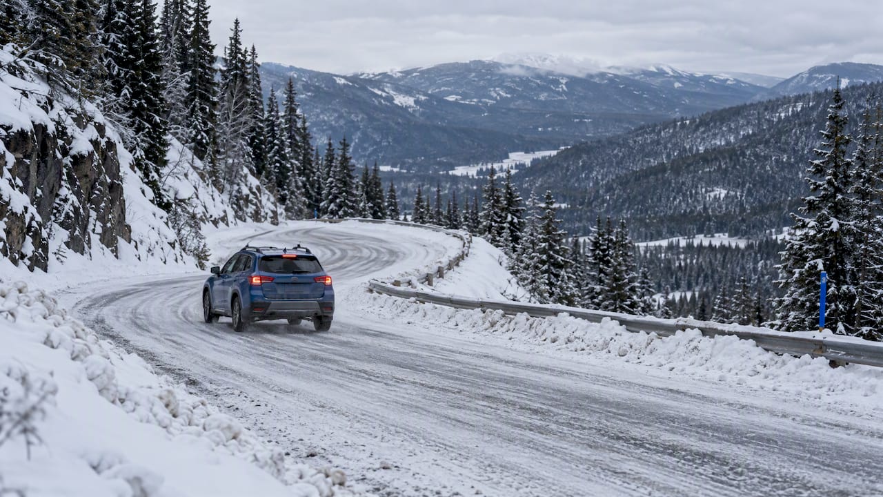 Vehicle braking on snowy mountain descent