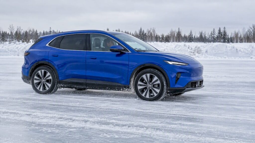 Electric crossover slowing on an icy lane