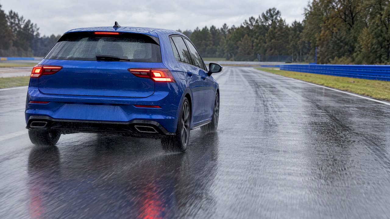 Car braking on a rain-wet test track
