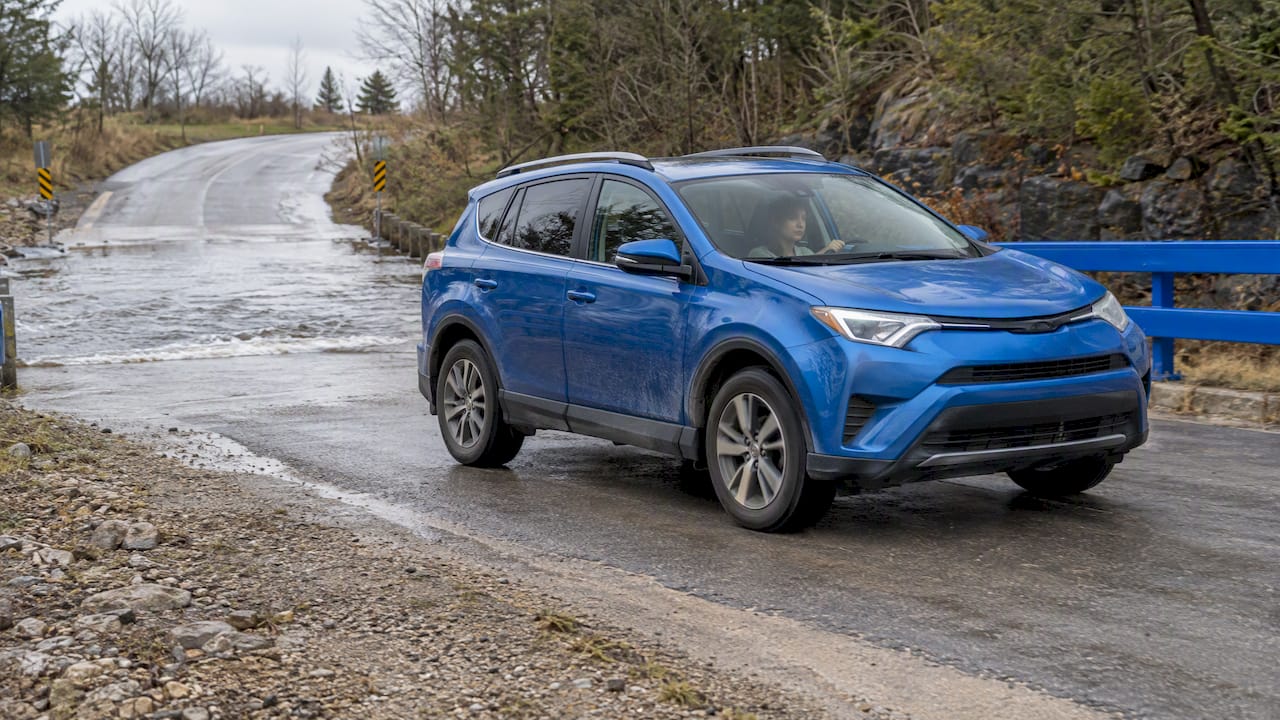 Car testing brakes after shallow water crossing